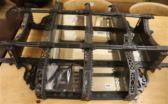 An ebonised mirror, W.83cm (a.f.)